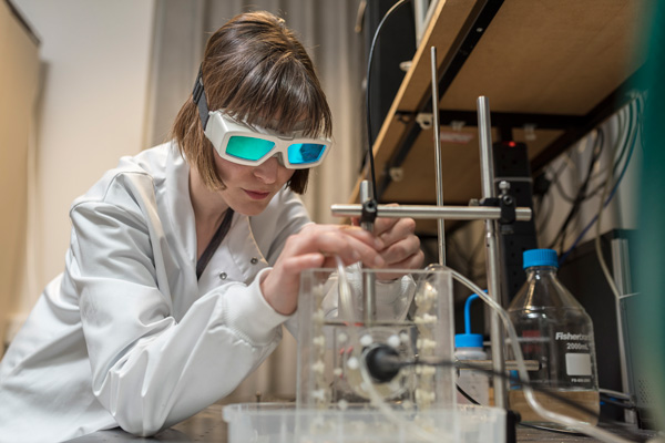 Image of researcher conducting a photoacoustic characterisation experiment.